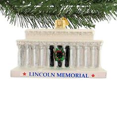 the lincoln memorial ornament is hanging on a christmas tree branch in front of a white background