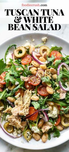 a white plate topped with salad and beans