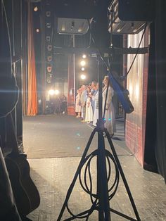 a group of people standing on top of a stage