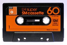 an orange and black cassette with the words lh super smaassette on it