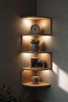 three shelves with clocks and pictures on them in a corner next to a potted plant