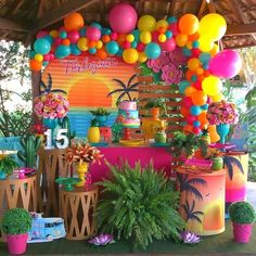 there are many colorful balloons and decorations on the wall in this party decorationating area