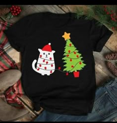 a t - shirt with a cat and christmas tree on it