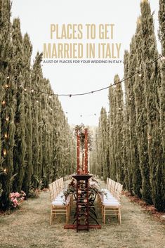 a table set up in the middle of an outdoor ceremony with string lights strung over it