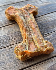 a dog bone on a wooden table