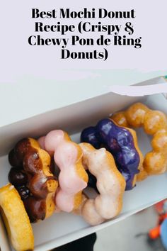 a box filled with different types of doughnuts