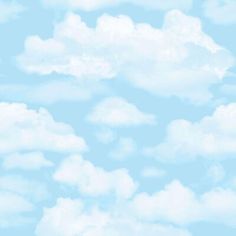 an airplane is flying through the blue sky with white clouds in the backround