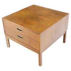 a wooden table with two drawers on one side and an open drawer on the other