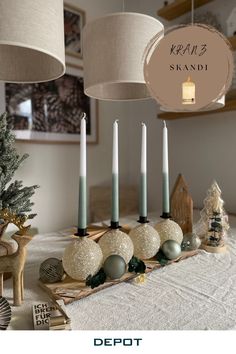 a table with candles and ornaments on it