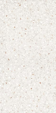 a white and brown speckled wallpaper with lots of dots on the top right corner