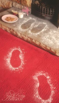 a red rug with the word go written in white chalk on it next to a plate of food