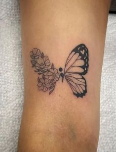 a butterfly with flowers on its back