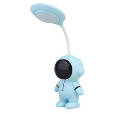 a blue toy with an eyeball on it's head and a light in the middle