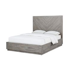 a bed with a wooden headboard and white sheets