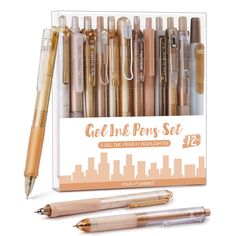 an assortment of pens and pencils in a display box with the words get ink pen set 12