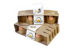 three boxes of eggs sitting on top of each other