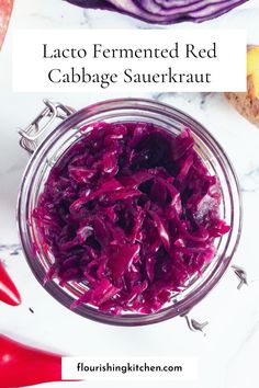 red cabbage sauerkraut in a glass jar on a marble surface with text overlay