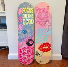 two skateboards are standing next to each other