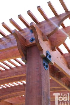 a wooden structure with metal brackets attached to it