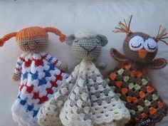 three crocheted stuffed animals sitting next to each other