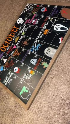 a close up of a board game on the floor with numbers and symbols painted on it