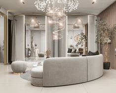 a living room filled with lots of furniture and a chandelier hanging from the ceiling