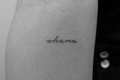 a woman's arm with the word anana written in cursive font