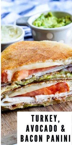 turkey, avocado and bacon panini cut in half