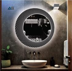 a bathroom with a round mirror above the sink and a bowl on the counter in front of it