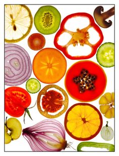 an assortment of fruits and vegetables are arranged in the shape of a circle on a white background