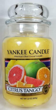 yankee candle with citrus and oranges on the inside, in a glass jar that says citrus