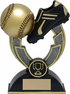 a baseball and shoe on top of a trophy