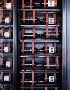 the wine cellar is filled with many bottles