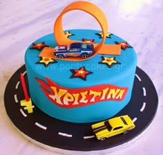 a birthday cake with cars and stars on it