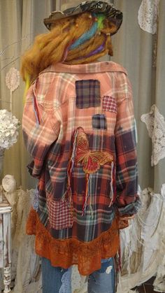 a mannequin dressed in an orange plaid jacket