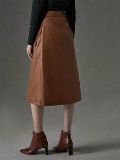 Knee-length Faux Leather Skirt For Work, Chic Knee-length Faux Leather Skirt, Faux Leather Knee-length Skirt For Work, Winter Leather Workwear Skirt, Leather Skirt For Winter Workwear, Leather Skirt For Workwear In Winter, Leather Workwear Skirt For Winter, Spring Knee-length Leather Skirt, Winter Leather Midi Skirt