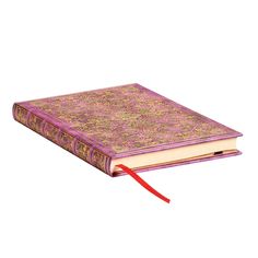 an open book with a red ribbon on the front and back cover, sitting on a white surface