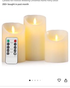 three lit candles with remote controls in front of them