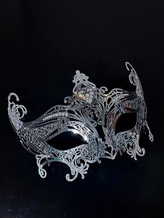 Step into the world of upscale glamour with our exquisite women's silver metal masquerade mask. The mask's silver shimmer adds an air of elegance, reflecting the light and adding a touch of enchantment to your appearance.

Age Group/Gender - Adult/Unisex

Size/Type - One size fits all adults

Mask Color - Silver

Shimmer Color - Silver

Mask Material - Lasercut Metal

Special Features - Rhinestones Elegant Wedding Masks, Elegant Masquerade Mask For Formal Occasions, Elegant Formal Mask For Carnival, Elegant Formal Masks For Carnival, Elegant Party Masks And Prosthetics, Elegant Eye Mask For Formal Masquerade, Elegant Party Eye Mask, Elegant Masks For Mardi Gras Costume Party, Elegant Adjustable Masquerade Mask For Mardi Gras