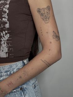 a woman with a tiger tattoo on her arm