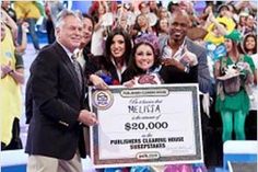 a group of people standing next to each other holding a large check for $ 500, 000