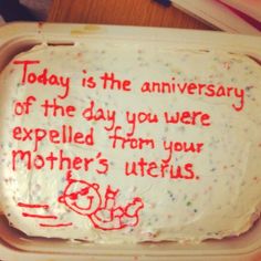 a birthday cake in a plastic container with writing on the frosting that says today is the anniversary of the day you were expeded from your mother's utensils