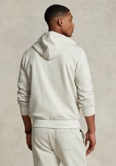 Made from sleek, double-knit fabric, this soft hoodie is an easy match for joggers or jeans. Size medium has a 27" body length, an 18.5" shoulder, a 44.5" chest, and a 35" sleeve length Sleeve length is taken from the center back of the neck and changes 1" between sizes Drawstring hood Full-zip front Long sleeves with ribbed cuffs Split kangaroo pocket Ribbed hem Signature embroidered Pony at the left chest The model is 6'1" (185 cm) and wears a size medium | Polo Ralph Lauren Men's Double Knit Mens Zip Hoodie, Soft Hoodie, Double Knit, Double Knitting, Polo Ralph Lauren Mens, Full Zip Hoodie, Grey Hoodie, Hoodie Top, Fleece Hoodie