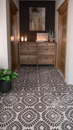 a bathroom with a large tile floor and wooden cabinets in the corner next to a potted plant