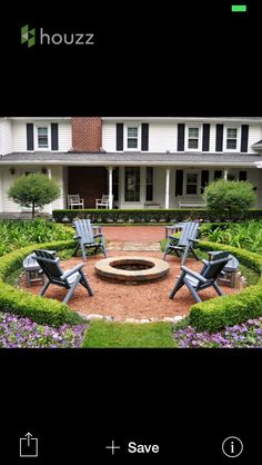 an image of a garden with chairs around the fire pit in front of a house