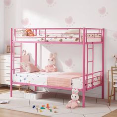 a pink bunk bed in a child's bedroom