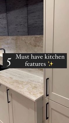 a kitchen with white cabinets and marble counter tops that says 5 must have kitchen features