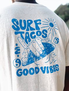 SURF, TACOS & GOOD VIBES. NO BETTER COMBO IF YOU ASK US . Introducing one of many of our latest summer graphics. Perfectly designed in our unique & sustainable hemp range. Our focus on a greener future just gets better. - 55% hemp / 45% organic cotton - 180gsm - Loose standard fit - Soft, breathable lightweight feel - Stretch ribbed neckline Refer to size chart for assistance in sizing Before you buy, feel free to research the benefits of hemp fabric not just for our planet, but for you and your Shirts With Designs On The Back, Surfing Tshirt Designs, Men T Shirts Design, Retro T-shirts, Surf Tshirt Design Ideas, Surf Shirt Design, Beach T Shirts Design, Beach Graphic Tee, Retro T Shirt Designs