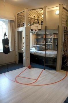 an indoor basketball court is in the middle of a room with two windows and a bed