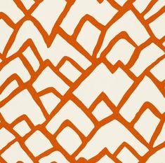 an orange and white pattern on fabric